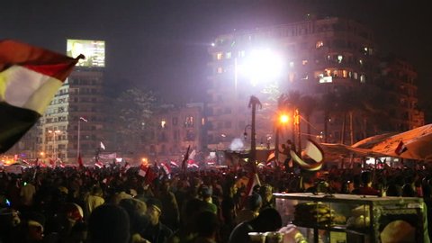 CAIRO, EGYPT - CIRCA JULY 2013: A large nighttime rally with fireworks in Tahrir Square in Cairo, Egypt.