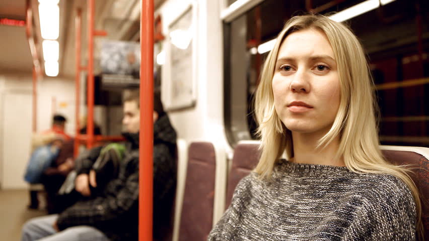 Beautiful young woman seat in vagon subway