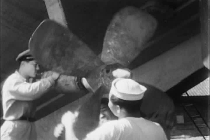 1950s - A Korean Navy sailor helps to repair a ship during the 1950s