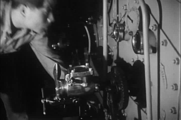 1950s - A Korean Navy sailor works through his sea-sickness to repair the ship during the 1950s