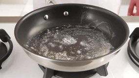 Eggs being cracked into a pan