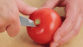 Cutting the stalk and core out of tomatoes