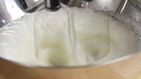 Whipping cream until stiff using an electric whisk