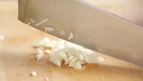 Garlic being finely chopped