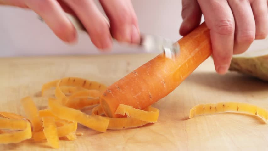 A carrot being peeled
