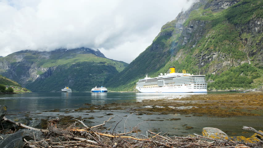 GEIRANGER, NORWAY - 12 JUNE 2013: Time lapse of cruise ships at the harbor of