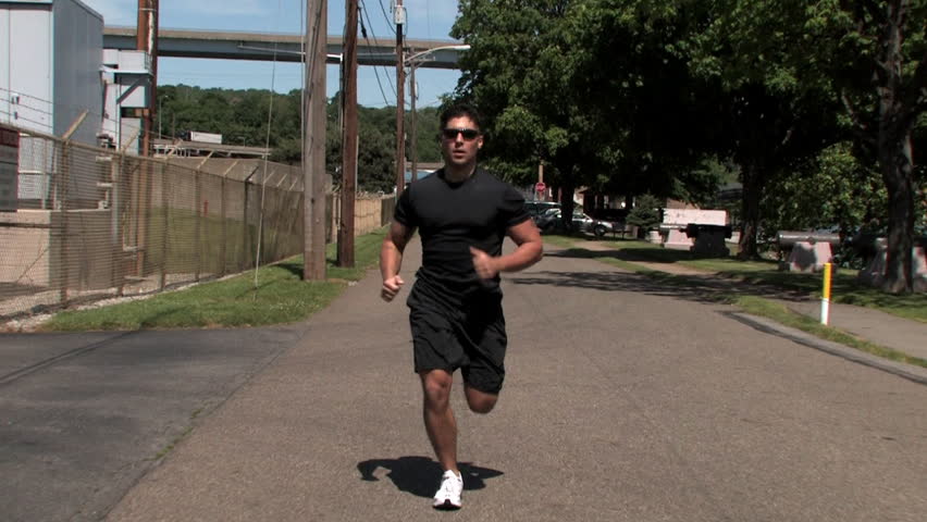 A man jogs in the park.