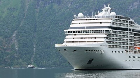 GEIRANGERFJORD, NORWAY - 12 JUNE 2013: Cruise ship approaching Geiranger in  Norway