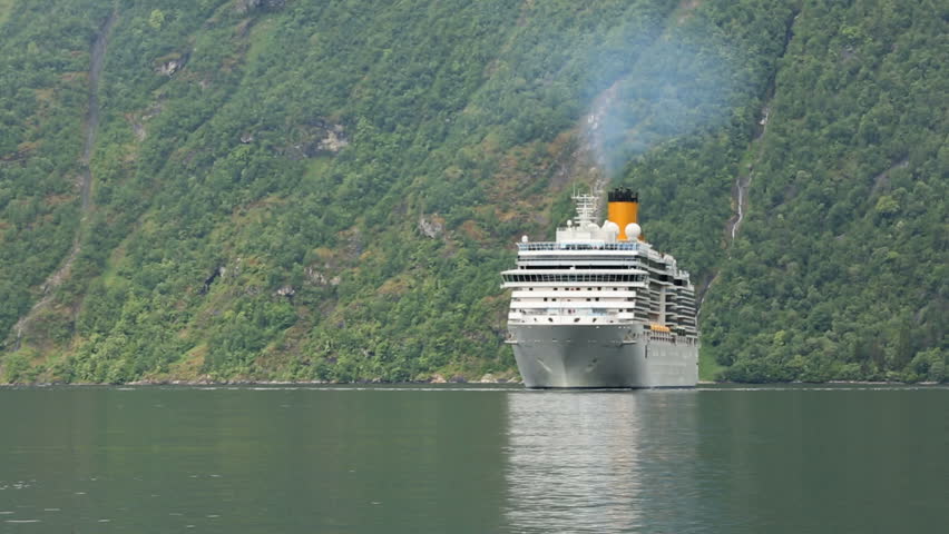 GEIRANGERFJORD, NORWAY - 12 JUNE 2013: Cruise ship approaching Geiranger in 