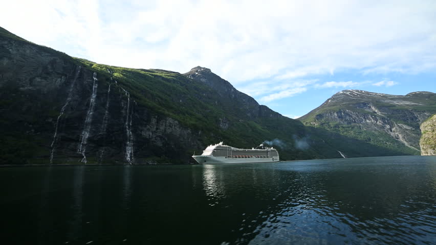 GEIRANGERFJORD, NORWAY - 12 JUNE 2013: Cruise ship approaching Geiranger in 