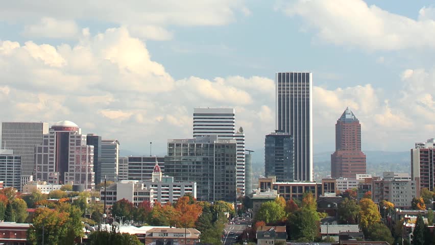 Portland Oregon Downtown City Skyline in Colorful Fall Autumn Season against Blue Sky and White Clouds Timelapse 1920x1080