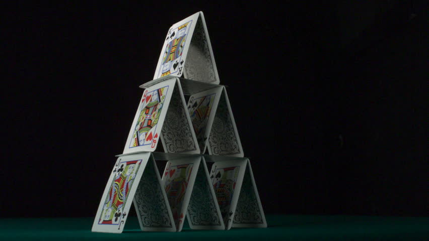 Pyramid house of playing cards falling down shooting with high speed camera, phantom flex.