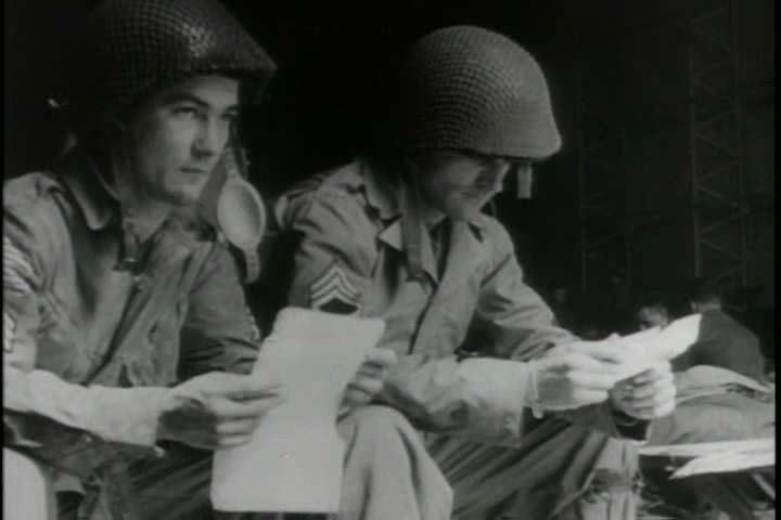 1940s - A group of American paratroopers make a jump behind enemy lines before D-Day during World War 2