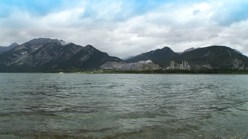 View across Lac des Arcs, Alberta, Canada.  Cement plant visible on far shore.