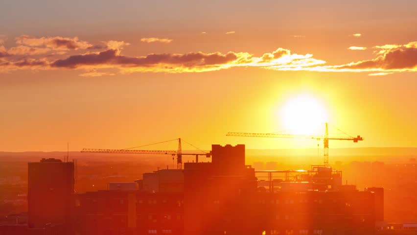 A Time-Lapse of the Sun setting over the city and disappearing behind the horizon.