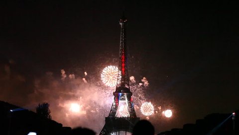 PARIS - JULY 14: night fireworks at the Eiffel Tower in the National Holiday, also known as Bastille Day, July 14, 2013 in Paris France