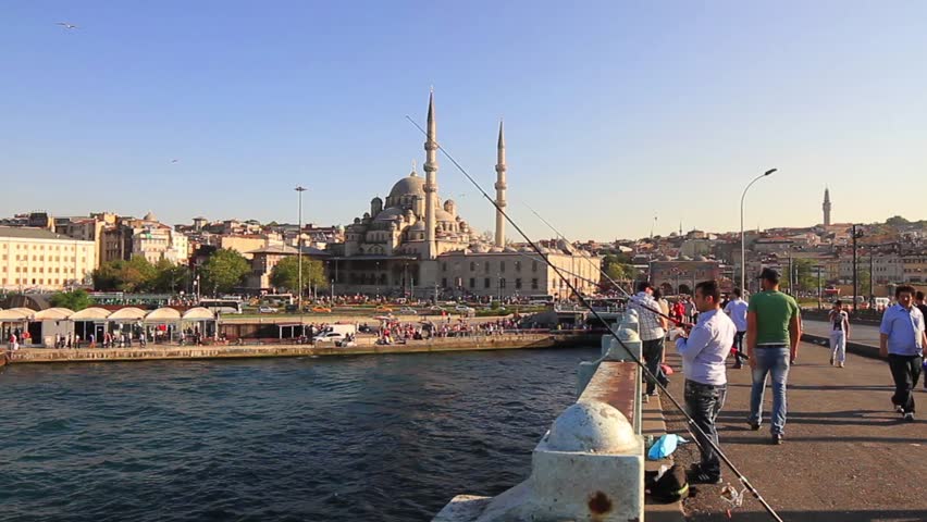 ISTANBUL - JUL 03: Yeni Mosque from Galata Bridge on July 03, 2013 in Istanbul,
