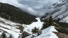 Clouds motion in the Alps mountains. Very foggy and cloudy. Time-lapse.