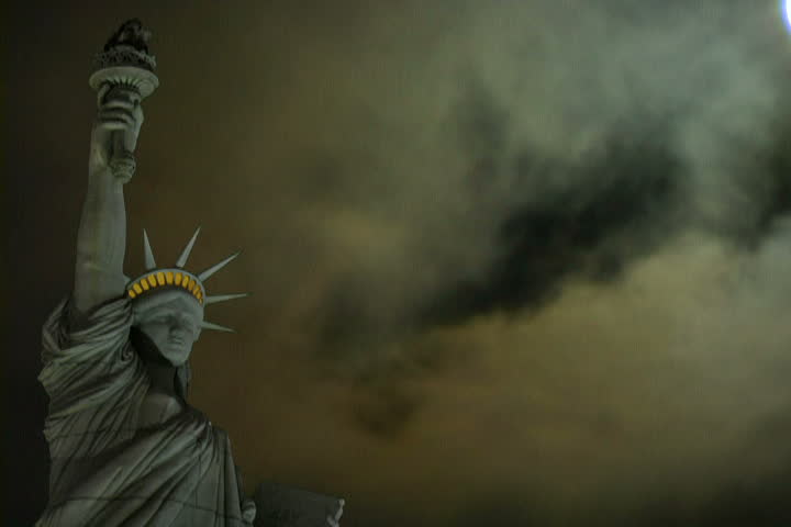 Composite of storm clouds at night and the Statue of Liberty, time lapse.