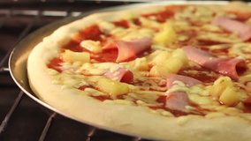 A Hawaii pizza in an oven (time lapse)