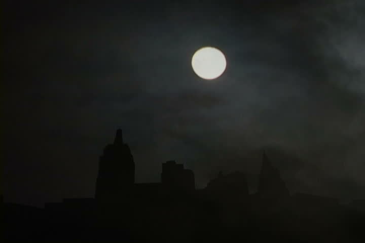 Composite of New York Cityscape at night with Full Moon and fog clouds, time