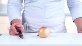 An onion being peeled