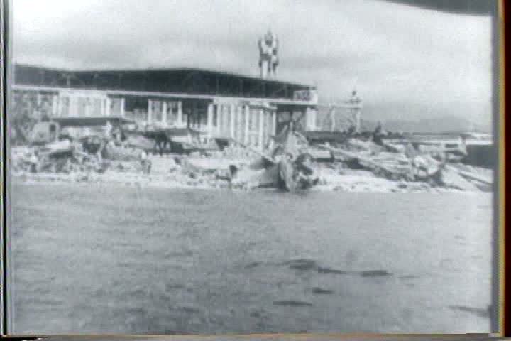 1940s - An African American priest presides over a church service to honor black soldiers in World War Two and we see blacks inducted into the army.