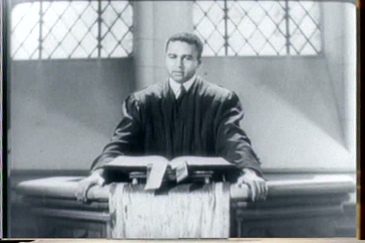 1940s - An African American priest presides over a church service to honor black soldiers in World War Two.
