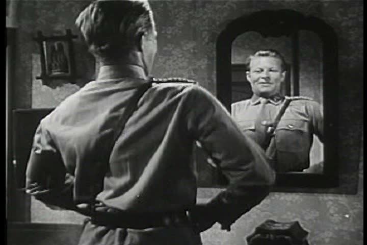 1940s - A man explains how the Nazis came to power as images of Nazi Germany are played during the 1940s