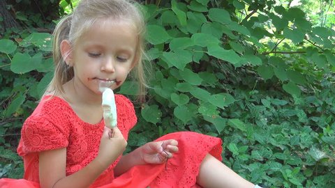 Child Eating, Licking Ice Cream, Girl Sitting on Grass in Park, Food, Children