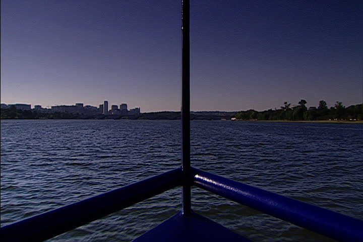 POV looking out over bow of boat while traveling on the Potomac River in Washington, D.C..