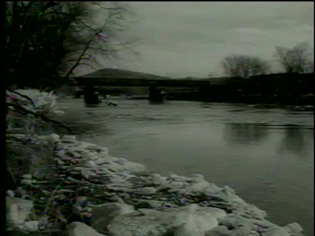 Flooded White River after heavy rains, White River Junction, Vermont circa 1964-MGM PICTURES, UNIVERSAL-INTERNATIONAL NEWSREEL, USA, filmed in 1964