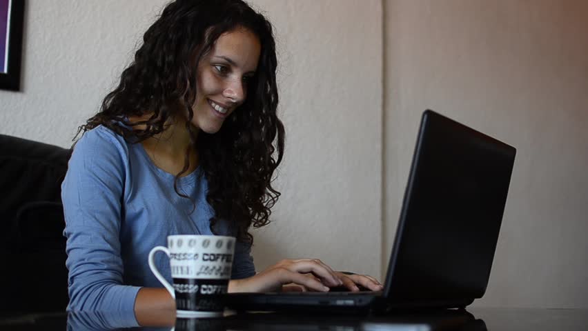 attractive young teenager surfing the internet laptop drinking tasty ice coffee