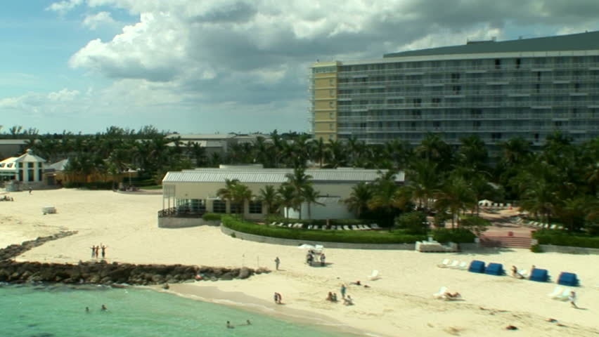 Island of the Bahamas and Caribbean with its beautiful beaches , blue water, sand as fine as sugar, and palm trees blowing in the warm trade winds.