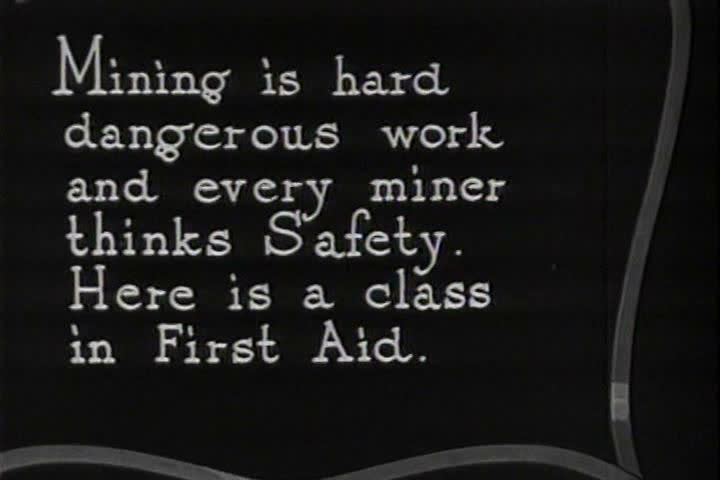 1920s - Miners prepare for accidents in the classroom by wrapping and bandaging, 1926.