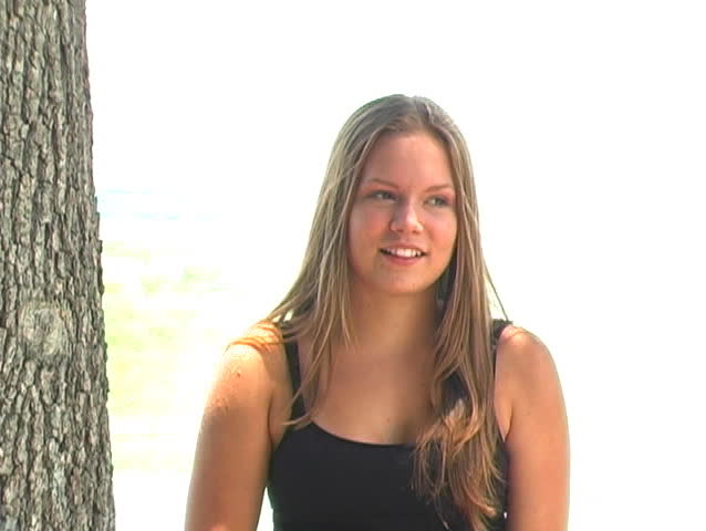 A lovely young blonde displays excitement and amazement.