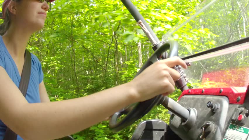 A woman driving an ATV
