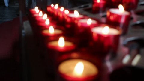 Candles in a church. blurred background.
