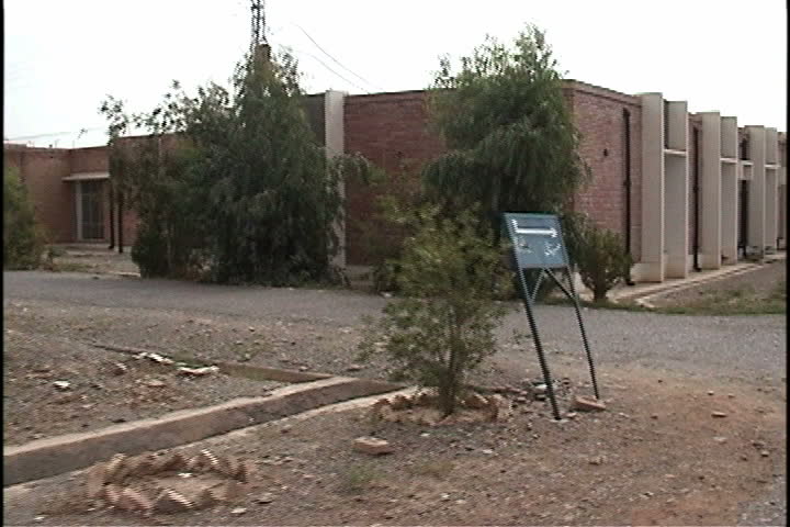 Sign and modern hospital building in outskirts of Mir Ali in Mir Ali, Pakistan.