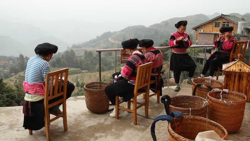 LONGSHENG, GUANGXI, CHINA - OCTOBER 22: Yao ethnic minority women embroidering