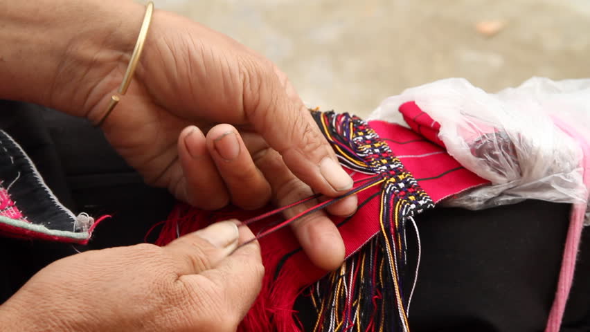 Details of Yao ethnic minority women hand weaver in Longsheng, Guangxi, China.