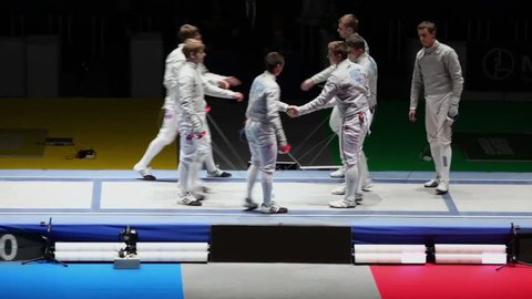 MOSCOW - APR 6: Sportsmen from Russian and Belarus national fencing teams shake hands during world championship among juniors and cadets, in Sports Olympic complex, on April 6, 2012 in Moscow, Russia