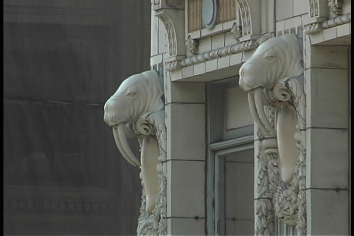 Shots of walrus gargoyles that border windows in the Arctic Building in Seattle, Washington.