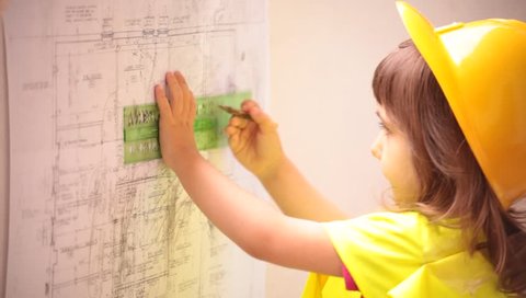 A child constructor architect looking at building plans, speaking to talkie walkie, measuring, drawing and calculating.
