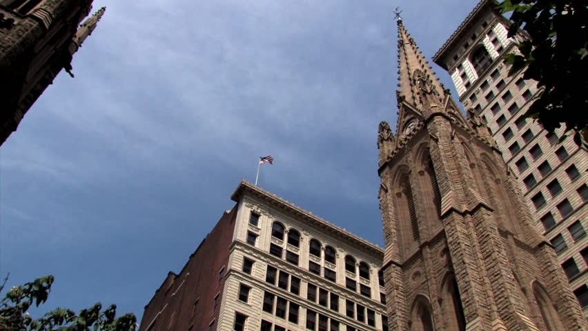 Tall buildings surround a downtown church in Pittsburgh, Pennsylvania.