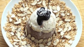 1920x1080 Hot fudge poured over ice cream, decorated with almond slivers  - Powered by Shutterstock - Get 15% off with code: PIKWIZARD15