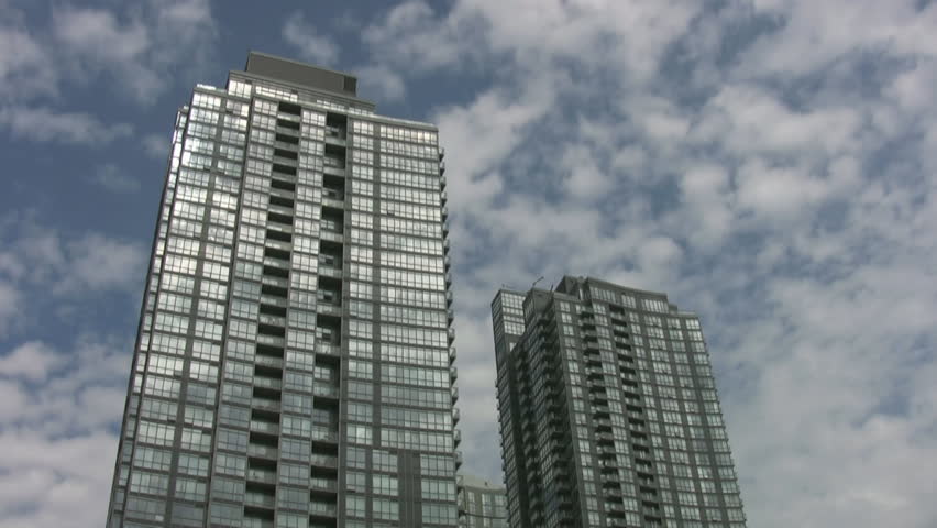 Condominiums. Fast timelapse clouds.