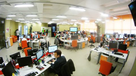 MOSCOW - MAR 05: (timelapse) Office room with people at their desks working and screen at RIA Novosti, on Mar 05, 2013 in Moscow, Russia.