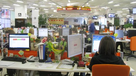 MOSCOW - MAR 05: (timelapse) Journalists at their desks working at RIA Novosti, on Mar 05, 2013 in Moscow, Russia.