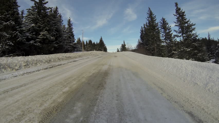 Low angle driving plate POV - Homer, Alaska in wintertime